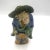 Antique Chinese mudman holding bad of coins and fan. Made in the Late 19th Century