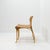 Model a chair produced by cristian valdés in his own workshop during the late 1970s. the chair features a laminated wood...