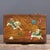 Handcrafted solid huali wood hinged jewelry box decorated with magnificent mother-of-pearl shell marquetry on the lid. The...