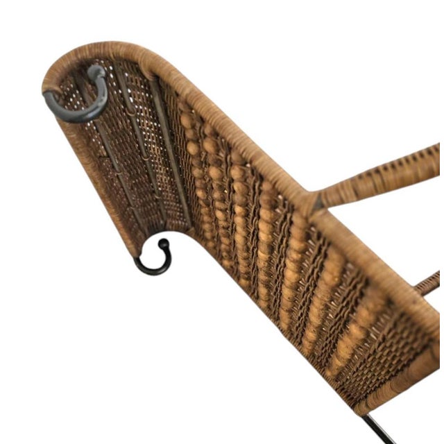 2 x wrought iron / rattan arm chairs 1970s Height 95 Depth 70 Width 55 Seat height 48 cm