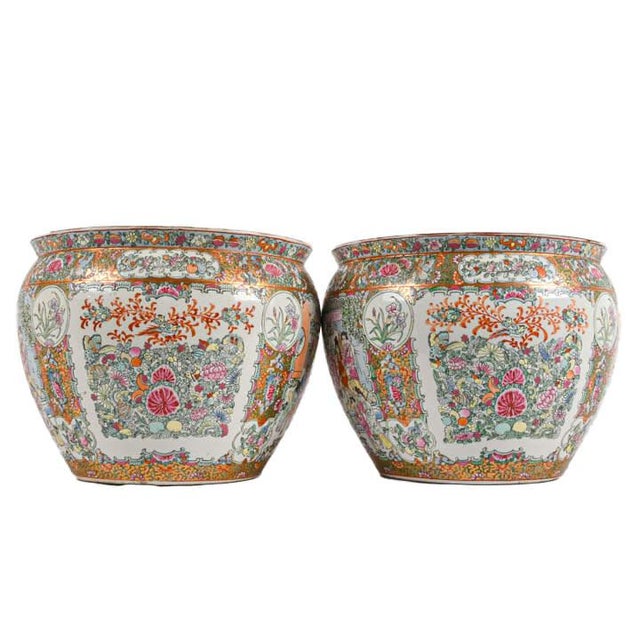 This impressive pair of Chinese Famille Rose porcelain fishbowl planters exemplifies the vibrant artistry and decorative...