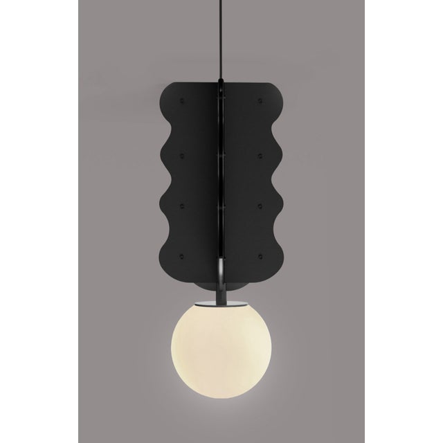 The "Hvylya" designer pendant lamp is a striking contemporary lighting fixture that captivates with its wave-inspired...