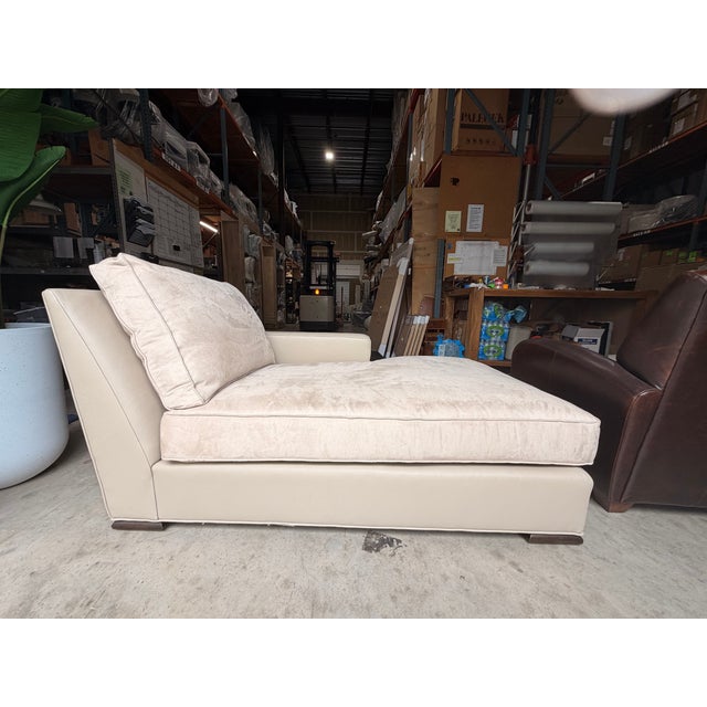 Sophisticated and modern, this contemporary chaise lounge features a taupe leather frame paired with a plush taupe suede...