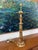 A classic Frederick Cooper table lamp featuring a fluted column form with a lotus-style capital and stepped circular base....