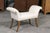 An English Mid-Century Modern small size bench with out-scrolled arms and saber legs. This English bench from the 1950s...