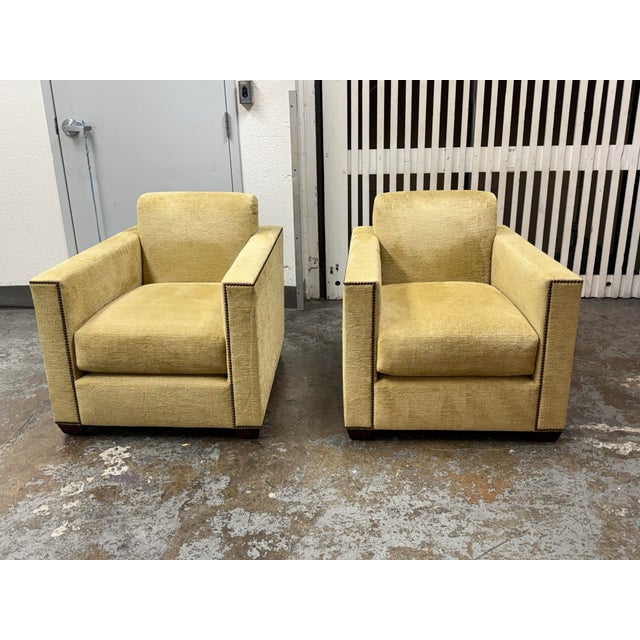 Design Plus Gallery presents a Pair of Manhattan Lounge Armchairs from Baker Furniture. Upholstered in golden yellow...