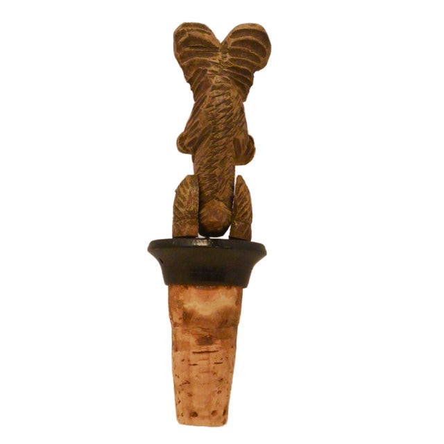 This is not your standard vintage bar accessory; it is a rare and highly collectible mechanical bottle stopper by the...