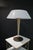 A striking mid-century modern table lamp designed by Gerald Thurston for Lightolier, featuring its original molded white...