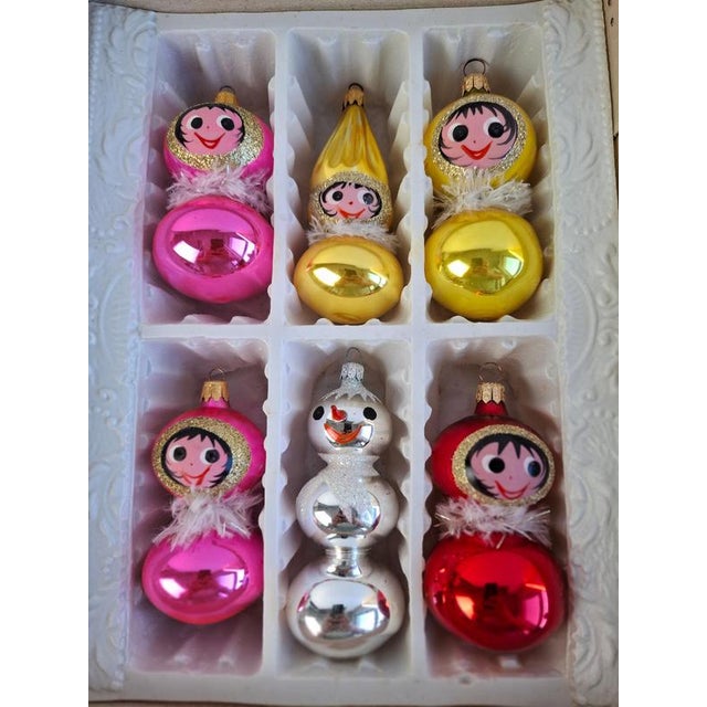 Charming set of six vintage Czechoslovak glass Christmas ornaments dating to circa 1960. The collection features colorful...