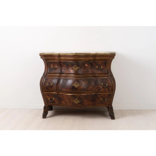 18th century chest of drawers from northern Sweden. The chest is Rococo with pronounced and curved sides and front. The...