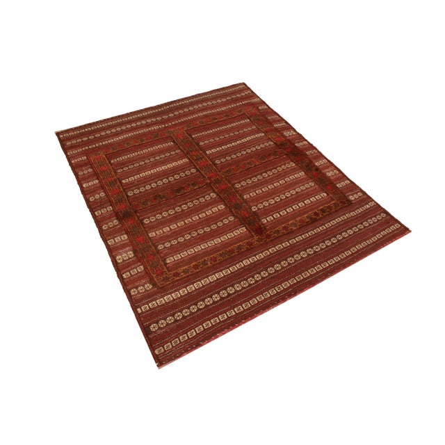 Made with hand-woven wool originating from Afghanistan between 1890-1900, this antique kilim enjoys a meticulous, refined...