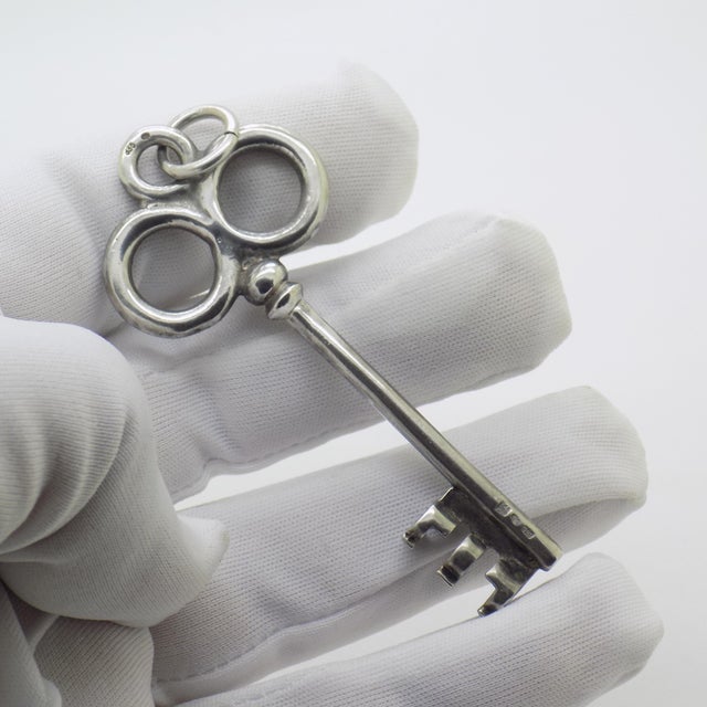 Richer in symbolism and tactile elegance, this vintage European decorative key is crafted in solid 835 continental silver....