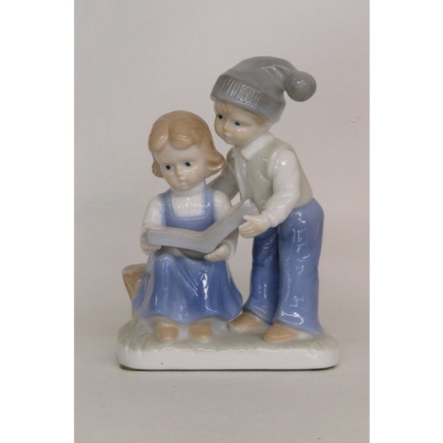 This charming Decorative Figurine is made of porcelain. Due to the style and design, we believe this was made by Lego...