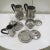 This art deco style coffee and tea set is made of stainless steel with bakelite handles. It is marked with the létang &...