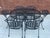 Unmarked Set of 6 wrought iron and metal mesh garden, patio, poolside dining chairs and a 54" Oval Table. The chairs have...