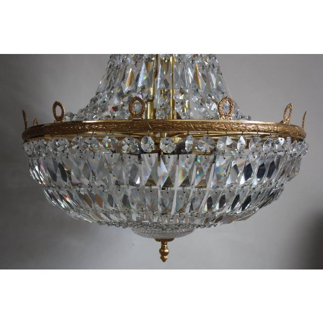 This huge fourteen-light basket chandelier was produced by high-end manufacturer Palwa. It is made of cut-crystal and...