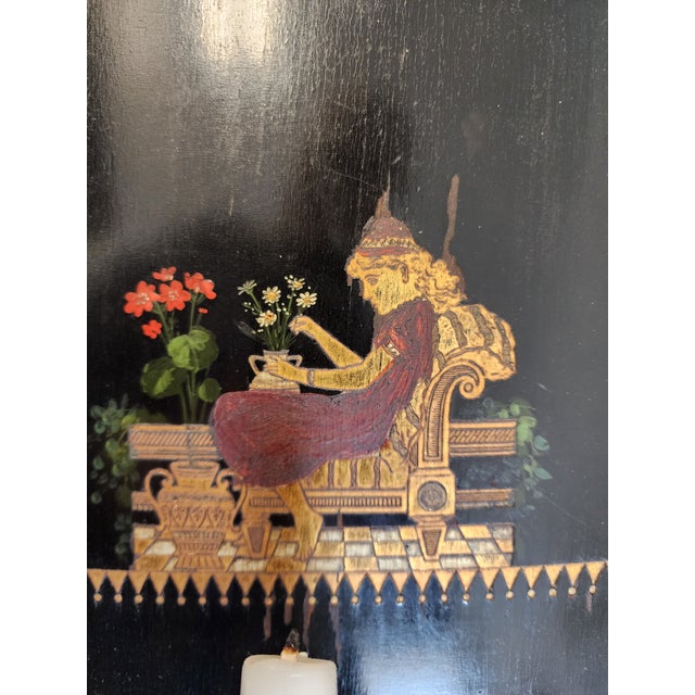 This eye catching, rare pair of late 19th-century Victorian Chinoiserie ebonized wall sconces will elevate any space....