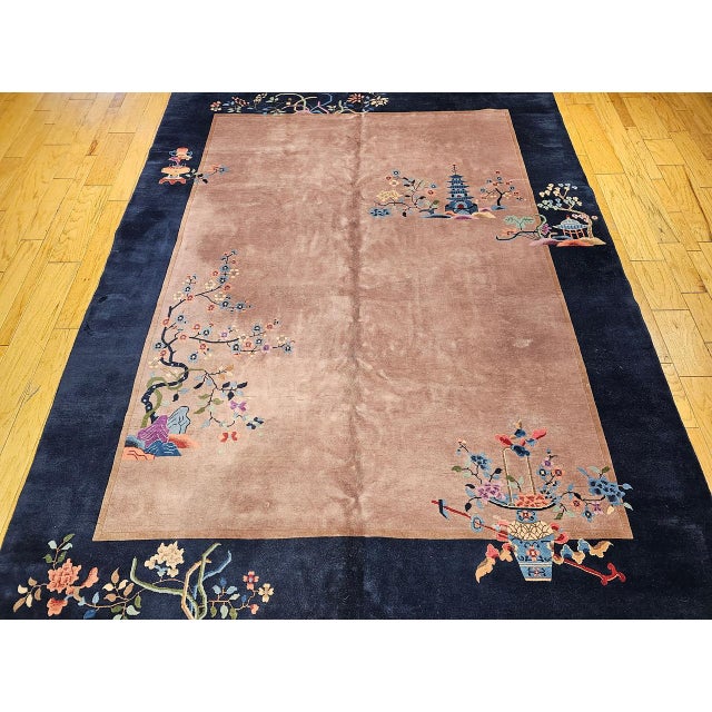 A truly stunning example of early 20th-century design, this vintage hand-knotted Chinese Art Deco Nichols rug is a rare...
