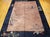 A truly stunning example of early 20th-century design, this vintage hand-knotted Chinese Art Deco Nichols rug is a rare...