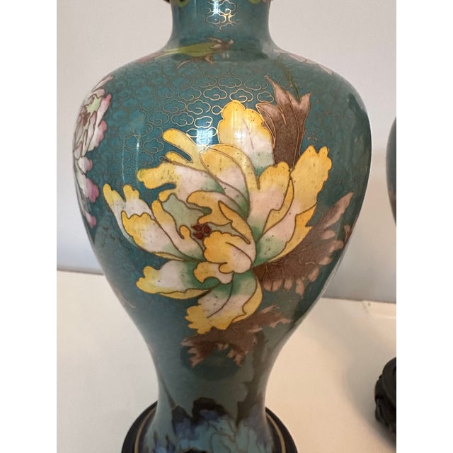 Beautiful workmanship, execution, and coloration in this pair of early twentieth century Japanese Cloisonné vases....