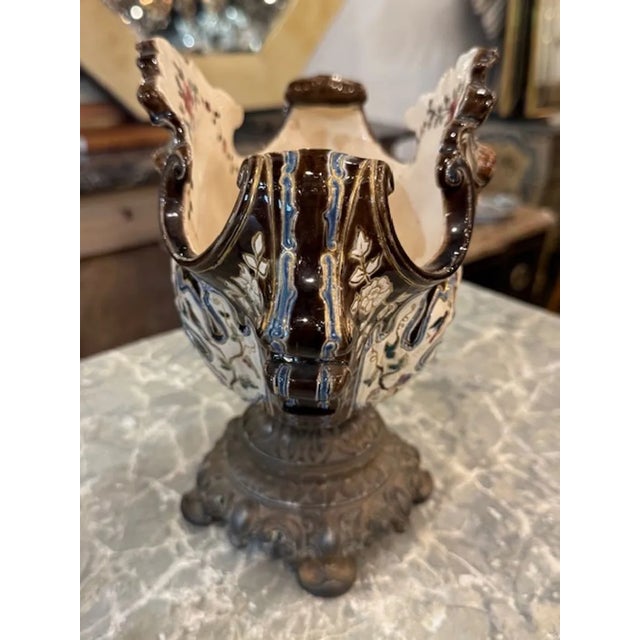 This Antique French Majolica and Brass Centerpiece is a stunning addition to any antique collection or vintage-inspired...