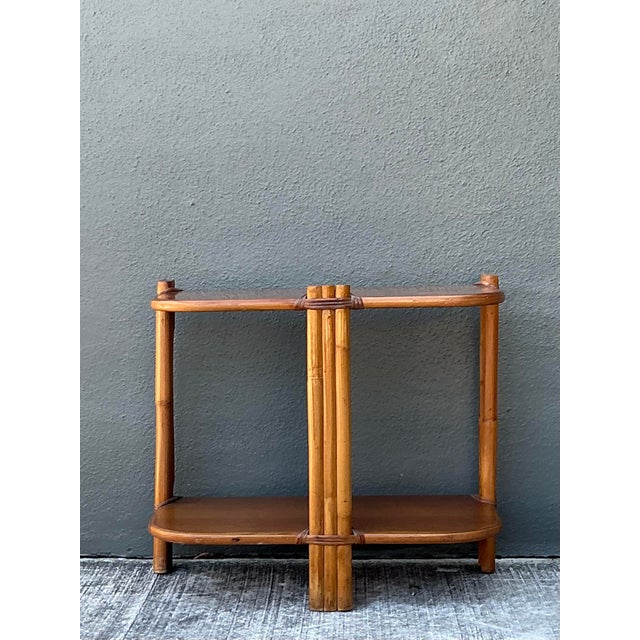 This charming Mid-Century Modern side table exemplifies the organic elegance of 1960s tropical design. Expertly crafted...