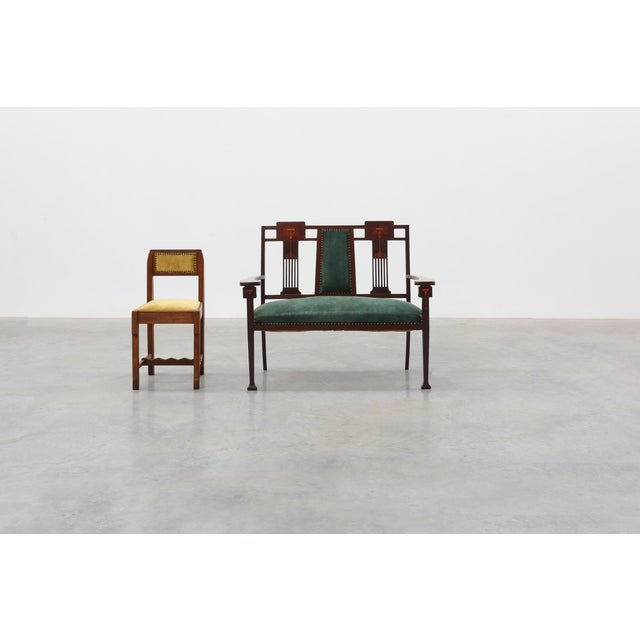 An elegant Belgian Art Nouveau two-seater settee dating from around 1900, distinguished by its refined proportions,...