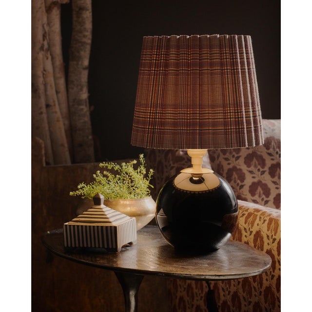 Compact yet striking, the Giorgio Mini Table Lamp is anchored by hand-blown black glass. Designed for versatility, it...