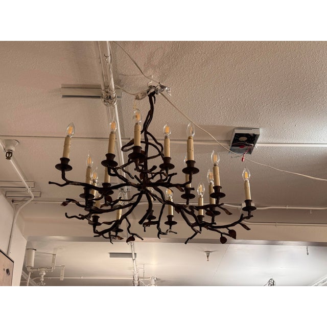 Design Plus Gallery presents a Twig Chandelier from Paul Ferrante. Model No. 2081 displays an intricate iron framework of...