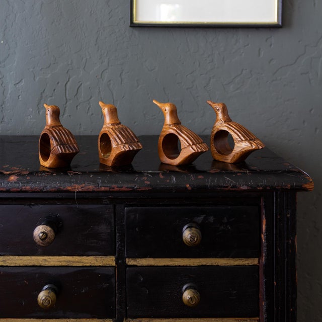 Set of four hand-carved bird or duck wooden napkin rings, made in the Philippines.