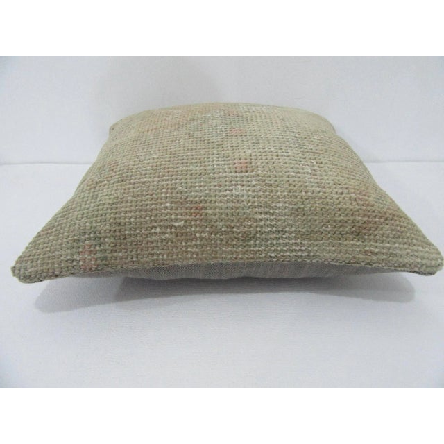 Decorative pillow cover made from a vintage Turkish handknotted rug. Backed with good quality cotton fabric. Pillow...