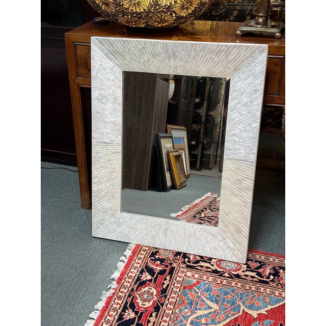 Design Plus Gallery presents the Capiz Rectangular Wall Mirror from Pottery Barn. The mirror features a frame handcrafted...