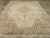 A vintage Turkish Oushak room size carpet. The pearl ground of this Turkish room size carpet displays sawtooth, curved...