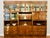 Henredon Campaign Bar Cabinet – Lighted Display, Pull-Out Serving Bar, Brass Hardware and Solid Wood For Sale - Image 10 of 11