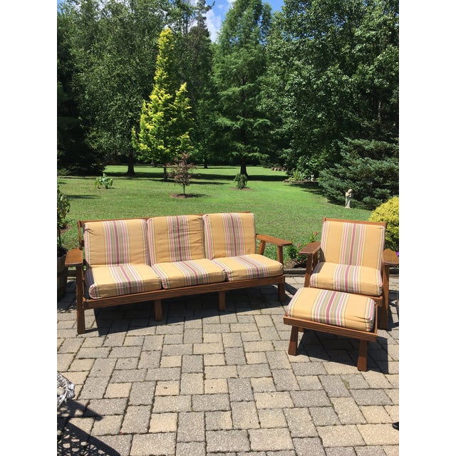 Mid-century Modern collectors sofa set including a sofa, chair, and ottoman. This western style set is made of solid oak....