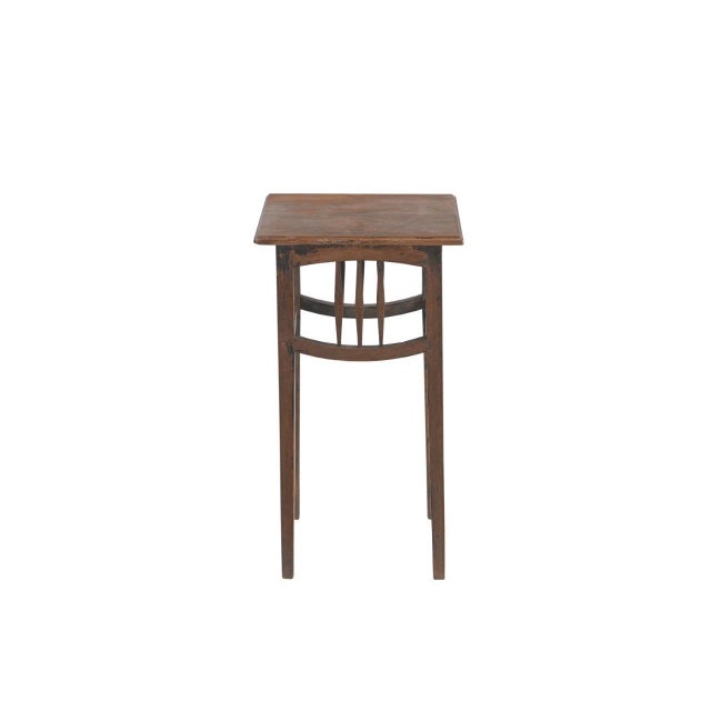 This Vintage Indian Teakwood Side Table is handcrafted from solid teakwood featuring a square top supported by slender...