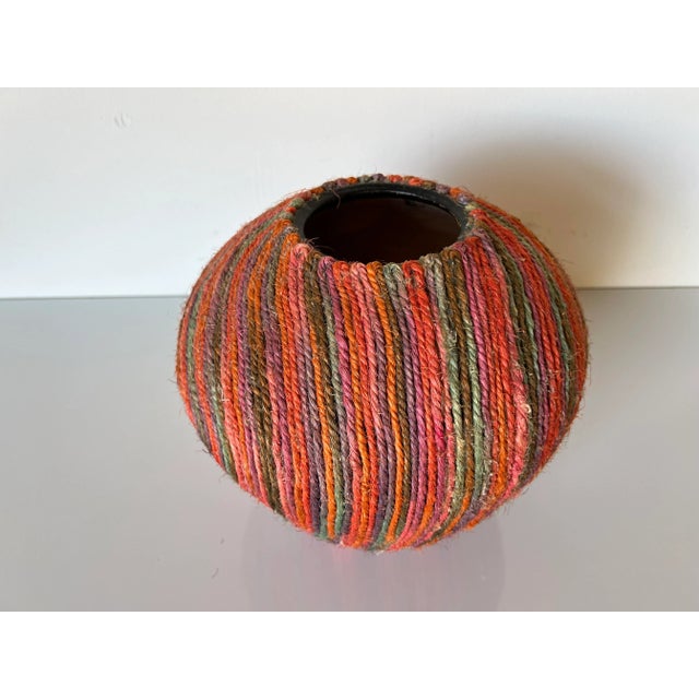 Available for sale this beautiful Vintage art handmade jute macrame fiber decorative colorful Vase. Constructed of hand...