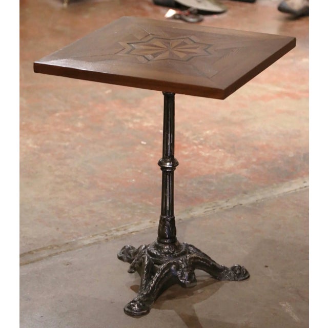 This exquisite, antique gueridon table was crafted in Paris, France, circa 1870. The intricate iron base sits on three paw...
