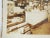 Antique silver gelatin photograph of the interior of a store and soda fountain. Stuffed full of cigars, candy, signs, Dr....