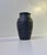 Number 747 relief vase in matte black glazed terracotta. Made during the 1890s on the Island of Bornholm by L. Hjorth...