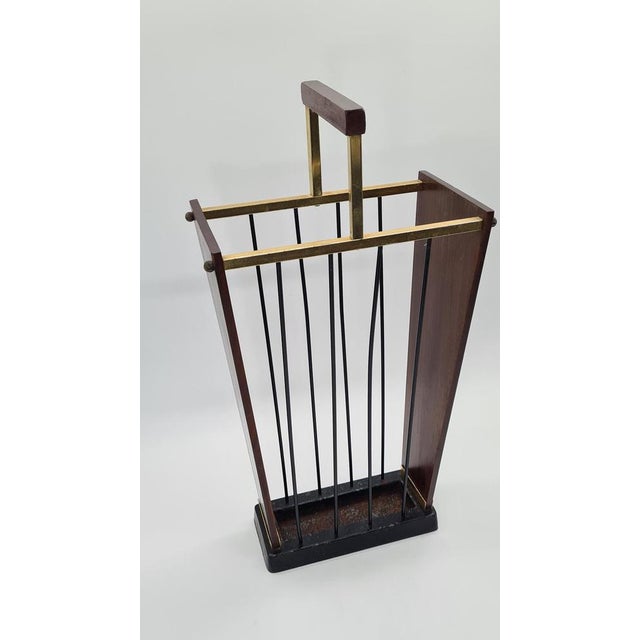 This mid-century modern umbrella stand, designed and manufactured in Germany in the 1960s, is an example of the precision...