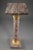 Brocatelle marble display column with sculpted and gilt bronze cap and base. The capital is embellished with ovals and...