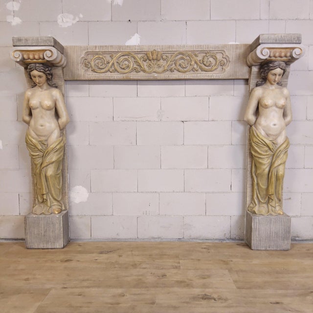 Description: a beautiful and unique old plaster fireplace featuring two semi-nude ladies acting as columns. These are...