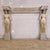 Description: a beautiful and unique old plaster fireplace featuring two semi-nude ladies acting as columns. These are...