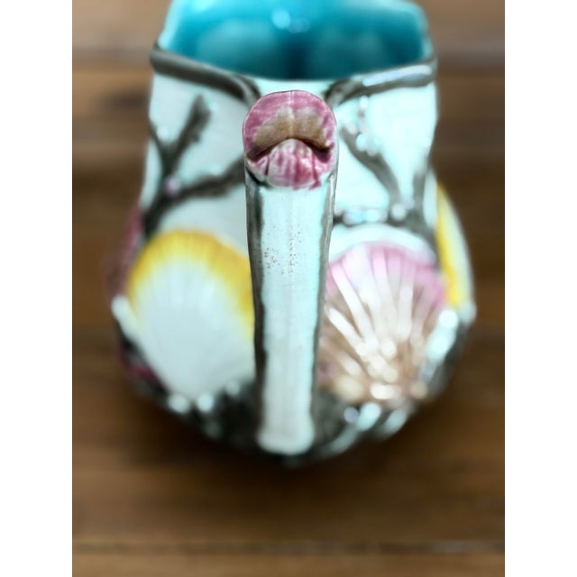 Dive into the elegance of the Victorian seaside with this rare Wedgwood Majolica pitcher, richly decorated with raised...