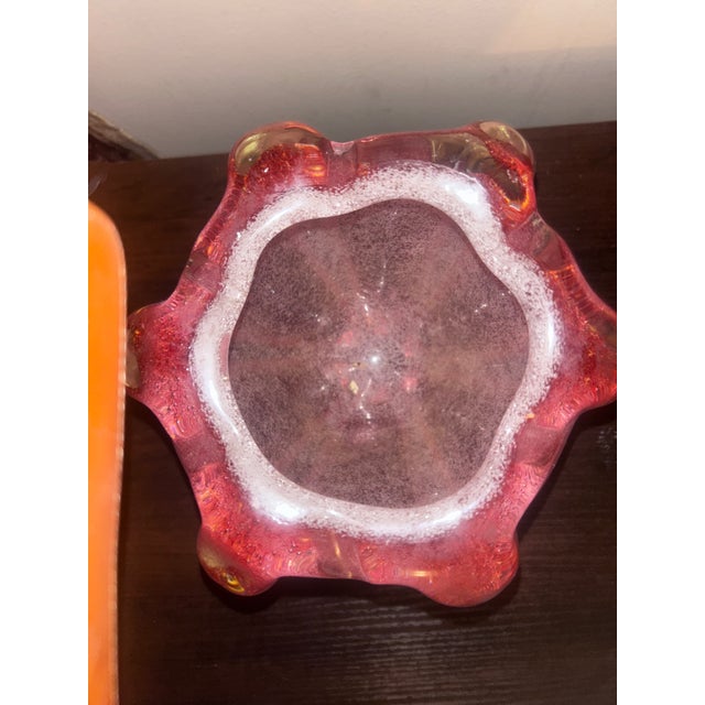 Striking vintage art glass centerpiece bowl in a rich cranberry pink hue with controlled bubble decoration and dramatic...