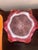 Striking vintage art glass centerpiece bowl in a rich cranberry pink hue with controlled bubble decoration and dramatic...
