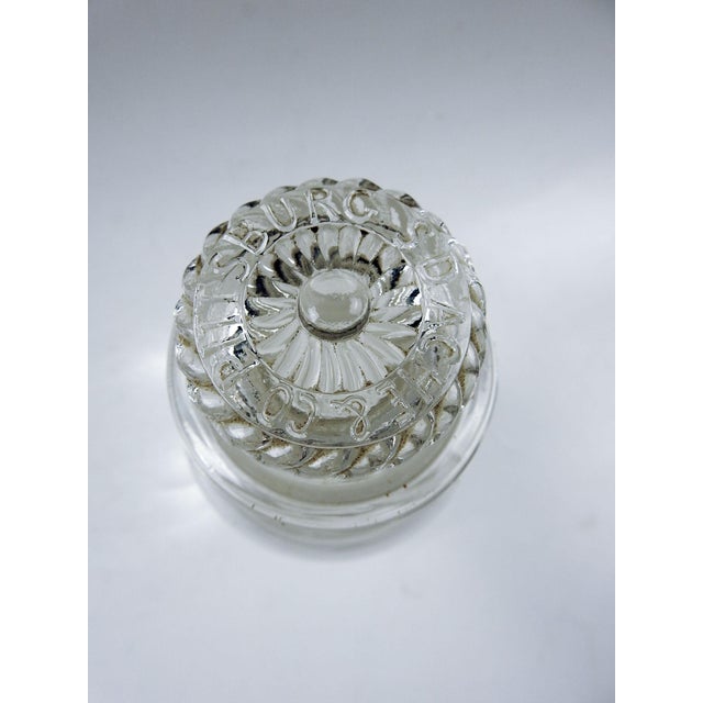 Antique mold blown glass apothecary jar. Top has decoration with company S. D. Ache, Co. Pittsburg embossed on top. Pontil...