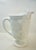 A monumental and crisp example of American mid-century milk glass. This commanding footed pitcher features the iconic...
