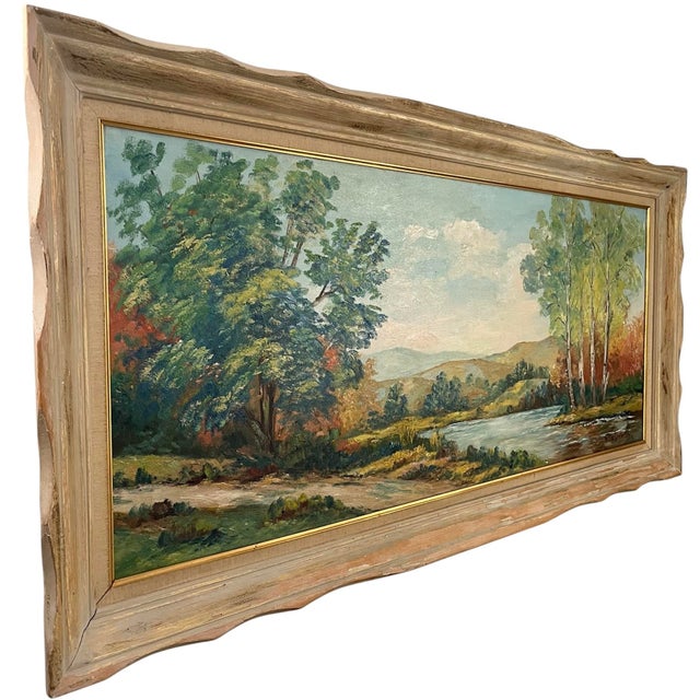 A lovely panoramic river view oil painting in its period frame by California artist, Ruby Dobesh (1905-2003). Ruby was...